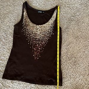 Dress up for day or night with this sequence tank top!